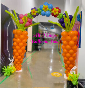 Balloon Carrot Flower arch with balloon bunnies